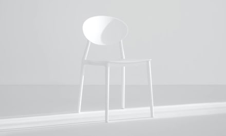 a light collor chair in a middle of the picture.